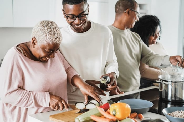 happy-black-family-cooking-inside-kitchen-home-father-daughter-son-mother-having-fun-preparing-lunch-main-focus-boy-face